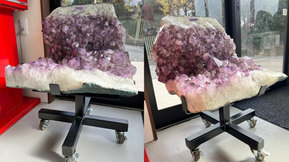 A desk chair made from an L-shaped piece of purple amethyst crystals