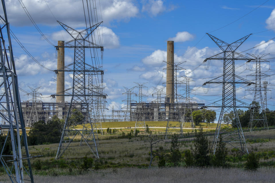 FILE - Power lines lead from the Liddell Power Station, a coal-powered thermal power station near Muswellbrook in the Hunter Valley, Australia on Nov. 2, 2021. Australia's main opposition party has announced, Wednesday, June 19, 2024, plans to build Australia's first nuclear power plants by 2037, arguing the government's policies for decarbonizing the economy with renewable energy sources including solar, wind turbines and green hydrogen would not work. (AP Photo/Mark Baker, File)