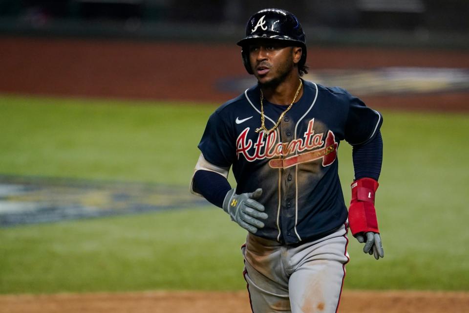 Ozzie Albies gets dirty, chains and all.