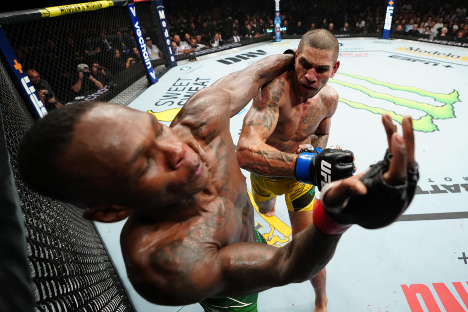 NEW YORK, NEW YORK - NOVEMBER 12: (R-L) Alex Pereira of Brazil punches Israel Adesanya of Nigeria in the UFC middleweight championship bout during the UFC 281 event at Madison Square Garden on November 12, 2022 in New York City. (Photo by Jeff Bottari/Zuffa LLC)