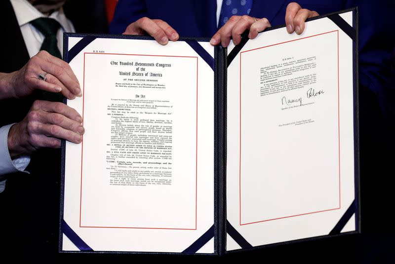 U.S. House Speaker Nancy Pelosi signs "The Respect for Marriage Act" on Capitol Hill