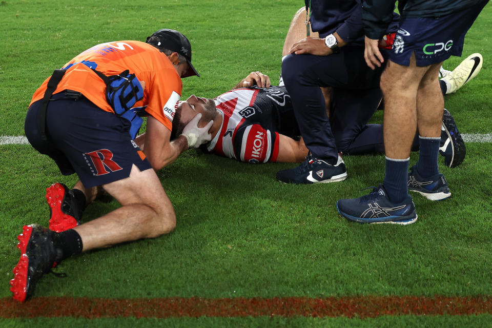 James Tedesco attended to by a trainer.