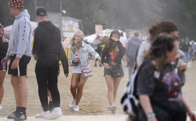 People being buffeted by the wind