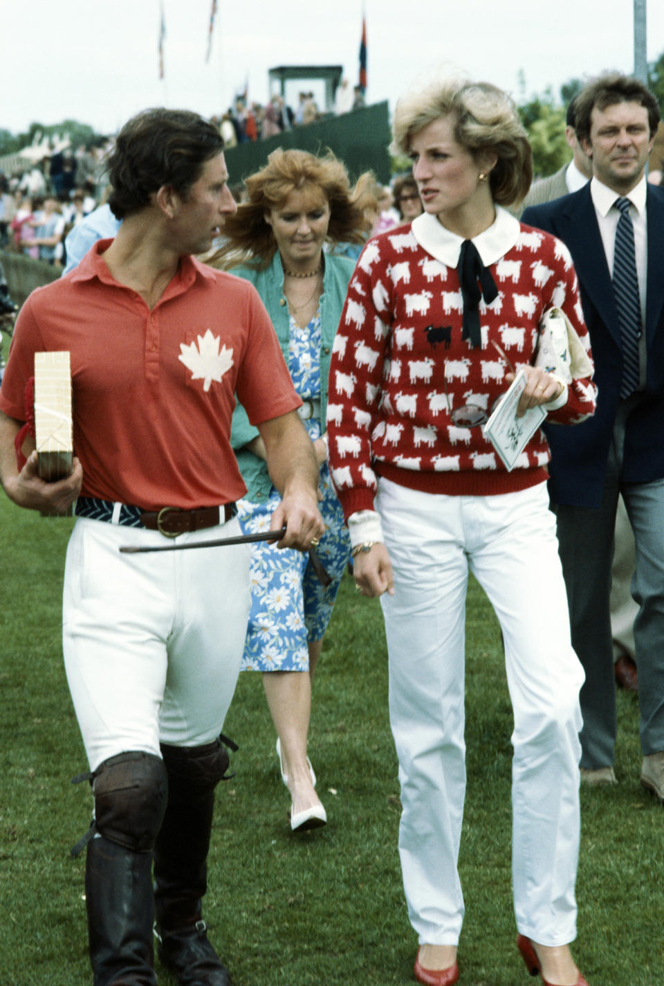 <p>Princess Diana was frequently on the sidelines of Prince Charles' games, socializing with friends like Sarah Ferguson. Here, she wears her famous <a href="https://people.com/royals/princess-diana-black-sheep-sweater/" rel="nofollow noopener" target="_blank" data-ylk="slk:black sheep sweater;elm:context_link;itc:0;sec:content-canvas" class="link ">black sheep sweater</a>.</p>