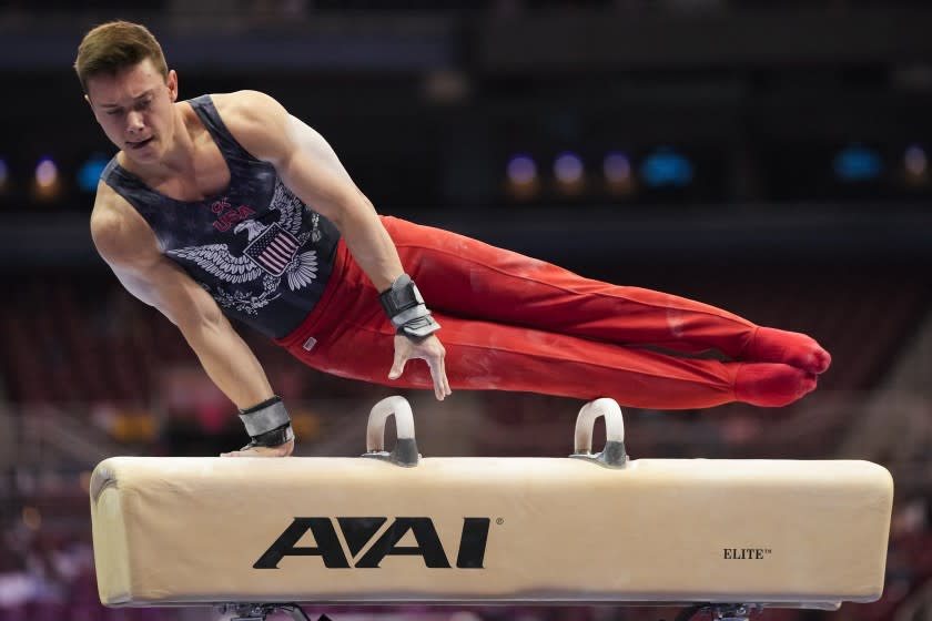 Brody Malone competes on the pommel horse during the men's U.S. Olympic Gymnastics Trials Thursday, June 24, 2021, in St. Louis. (AP Photo/Jeff Roberson)