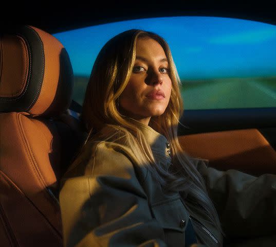 <p>Ford Motor Company</p> Sydney Sweeney in the custom built Mustang that will be given away by Ford