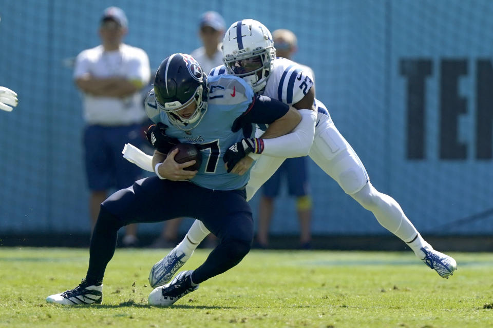 Tennessee Titans quarterback Ryan Tannehill (17) is sacked by Indianapolis Colts cornerback Kenny Moore II (23) during the first half of an NFL football game Sunday, Oct. 23, 2022, in Nashville, Tenn. (AP Photo/Mark Humphrey)