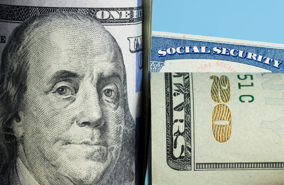 A rolled-up hundred dollar bill and twenty dollar bill partially covering a Social Security card.