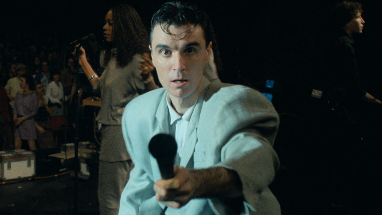  Lynn Mobray sings as David Byrne holds the mic to the camera in Stop Making Sense. 