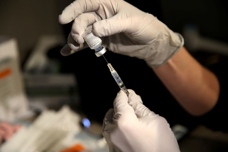 FILE PHOTO: COVID-19 vaccines are administered at Boston Medical Center in Boston