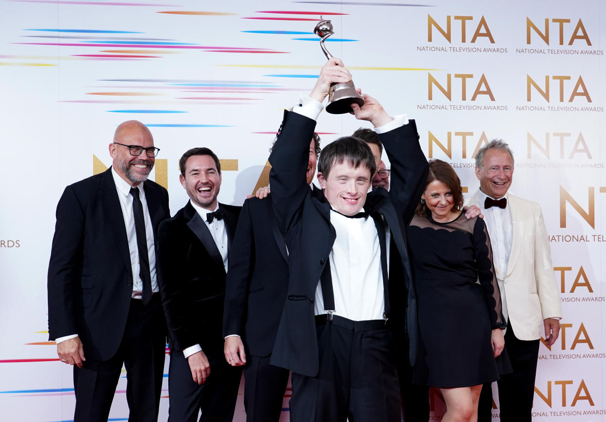 Tommy Jessop celebrates in the awards room with the cast and crew of Line of Duty after winning the Returning Drama award at the National Television Awards 2021 held at the O2 Arena, London. Picture date: Thursday September 9, 2021. (Photo by Ian West/PA Images via Getty Images)