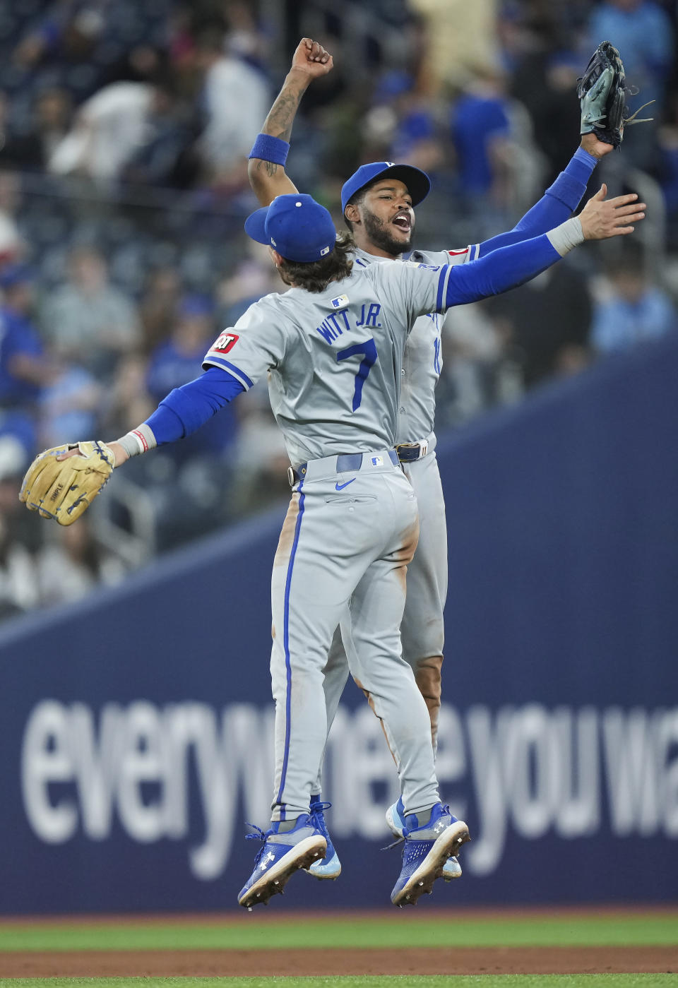Kansas City Royals' Bobby Witt Jr. (7) celebrates with teammate Maikel Garcia (11) after defeating the Toronto Blue Jays in a baseball game, Tuesday, April 30, 2024 in Toronto.(Nathan Denette/The Canadian Press via AP)