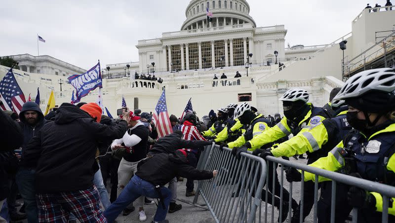 Protesters try to break through a police barrier on Wednesday, Jan. 6, 2021, at the Capitol in Washington.