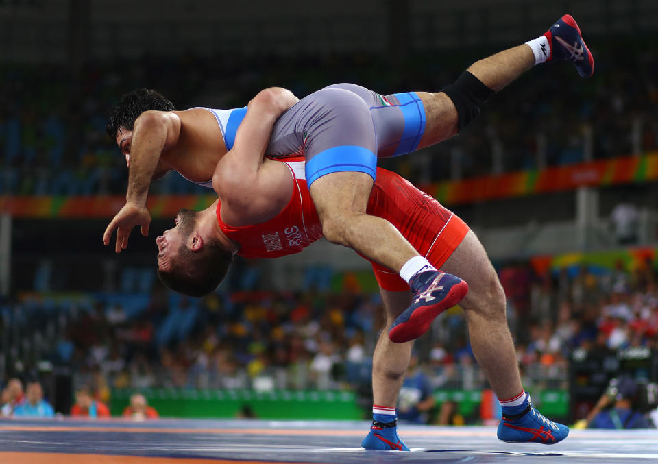 <p>Davit Chakvetadze of Russia competes against Habibollah Jomeh Akhlaghi of Iran during the Men’s Greco-Roman 85 kg on Day 10 of the Rio 2016 Olympic Games at Carioca Arena 2 on August 15, 2016 in Rio de Janeiro, Brazil. (Photo by Ryan Pierse/Getty Images) </p>