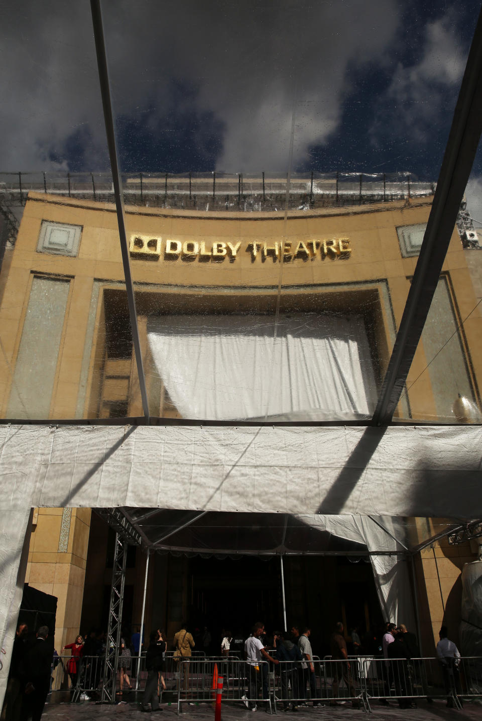 The Dolby Theatre is seen through a tent as preparations are made for the 86th Academy Awards in Los Angeles, Thursday, Feb. 27, 2014. The Academy Awards will be held at the Dolby Theatre on Sunday, March 2. (Photo by Matt Sayles/Invision/AP)