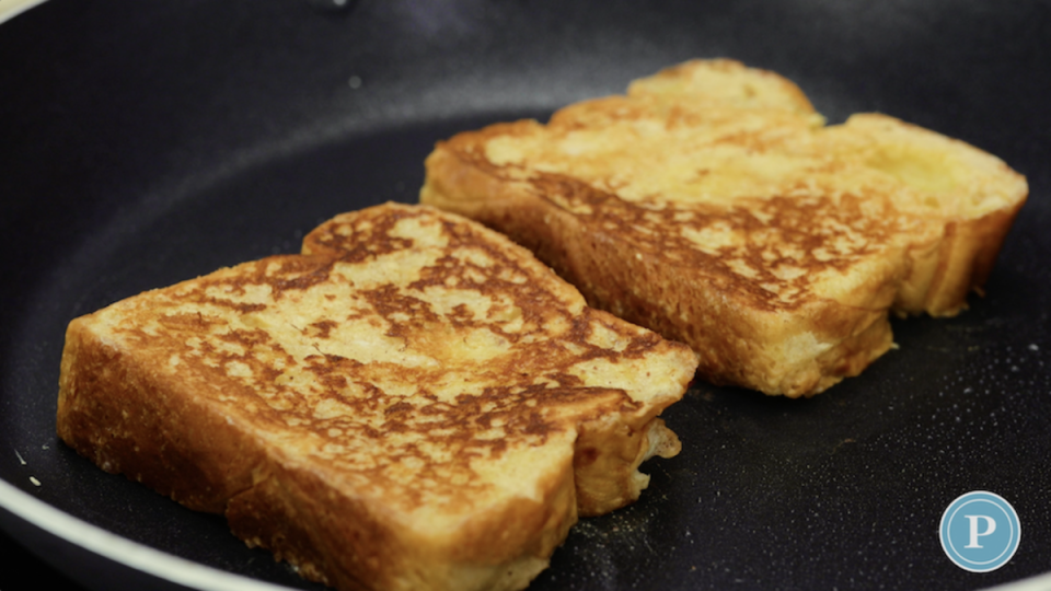 Cooking French Toast<p>Parade</p>