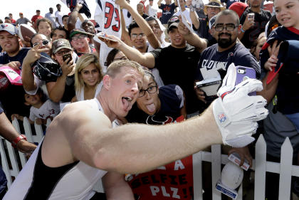 J.J. Watt, left, takes a selfie with a fan after a training camp practice last month. (AP)