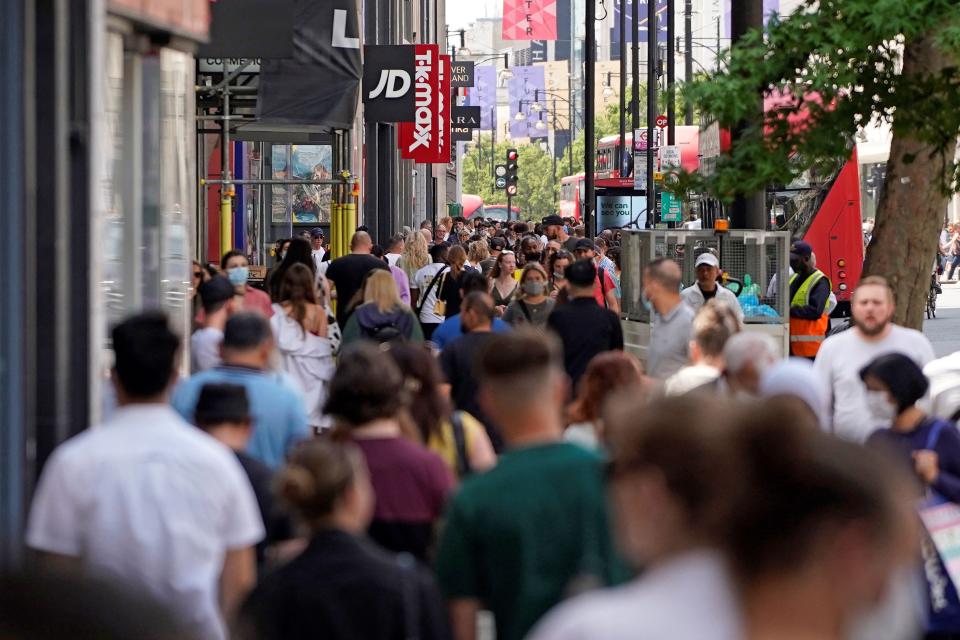 Shoppers returning to high streets helped to boost economy in April (AFP/Getty)