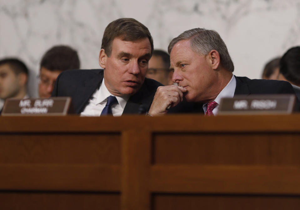 <p>Senate Intelligence Committee ranking member Mark Warner (L) talks with Chairman Richard Burr during former FBI Director James Comey’s appearance before a Senate Intelligence Committee hearing on Russia’s alleged interference in the 2016 U.S. presidential election on Capitol Hill in Washington, June 8, 2017. (Photo: Aaron P. Bernstein/Reuters) </p>