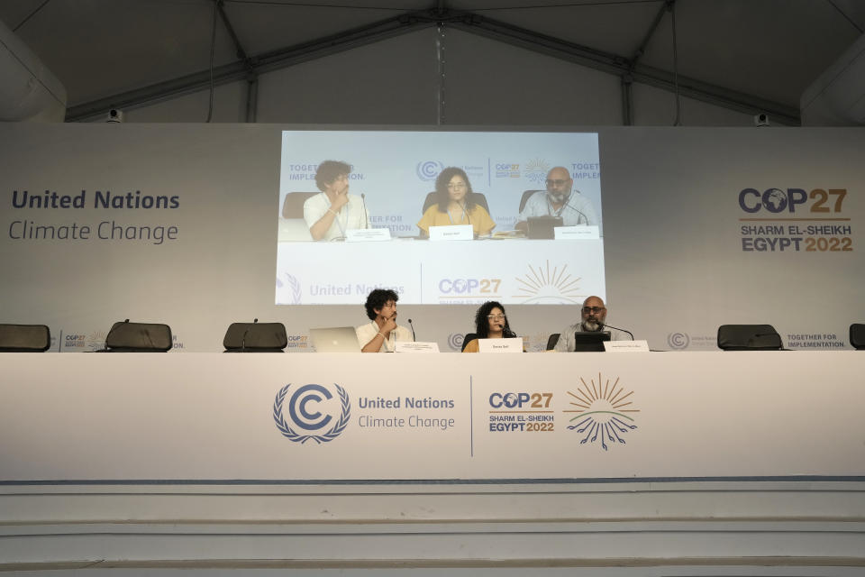 From left, Gadir Lavadenz, of the Global Campaign to Demand Climate Justice, Sanaa Seif, sister of Egypt's jailed leading pro-democracy activist Alaa Abdel-Fattah, who is on a hunger and water strike, Asad Rehman, War on Want, speak at a news conference at the COP27 U.N. Climate Summit, Tuesday, Nov. 8, 2022, in Sharm el-Sheikh, Egypt. (AP Photo/Nariman El-Mofty)