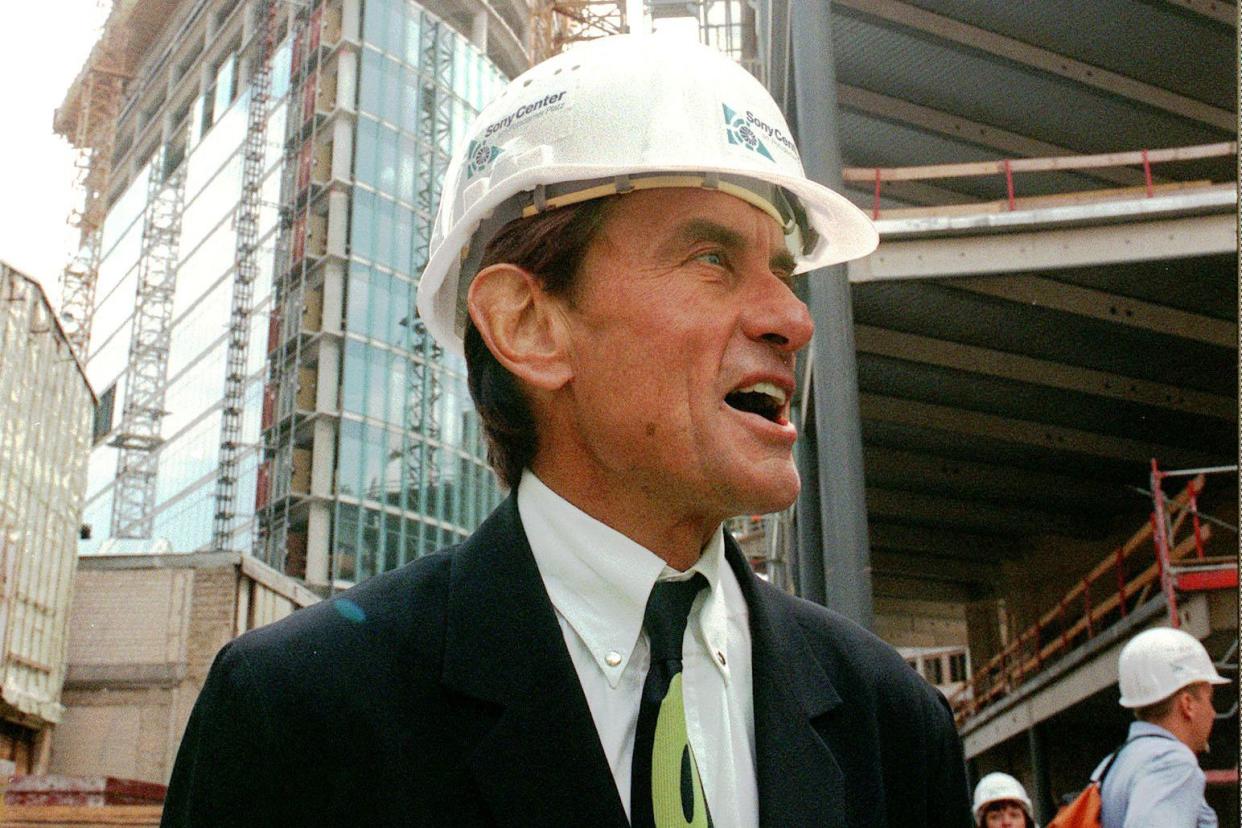 CORRECTS TO WEST, NOT EAST - FILE - In this Wednesday, July 15, 1998 file photo, architect Helmut Jahn tours a construction site in Berlin. Jahn, 81, was killed when two vehicles struck the bicycle he was riding on Saturday afternoon, May 8, 2021, while riding north on a village street in Campton Hills, about 55 miles west of Chicago. (AP Photos/Jockel Finck)