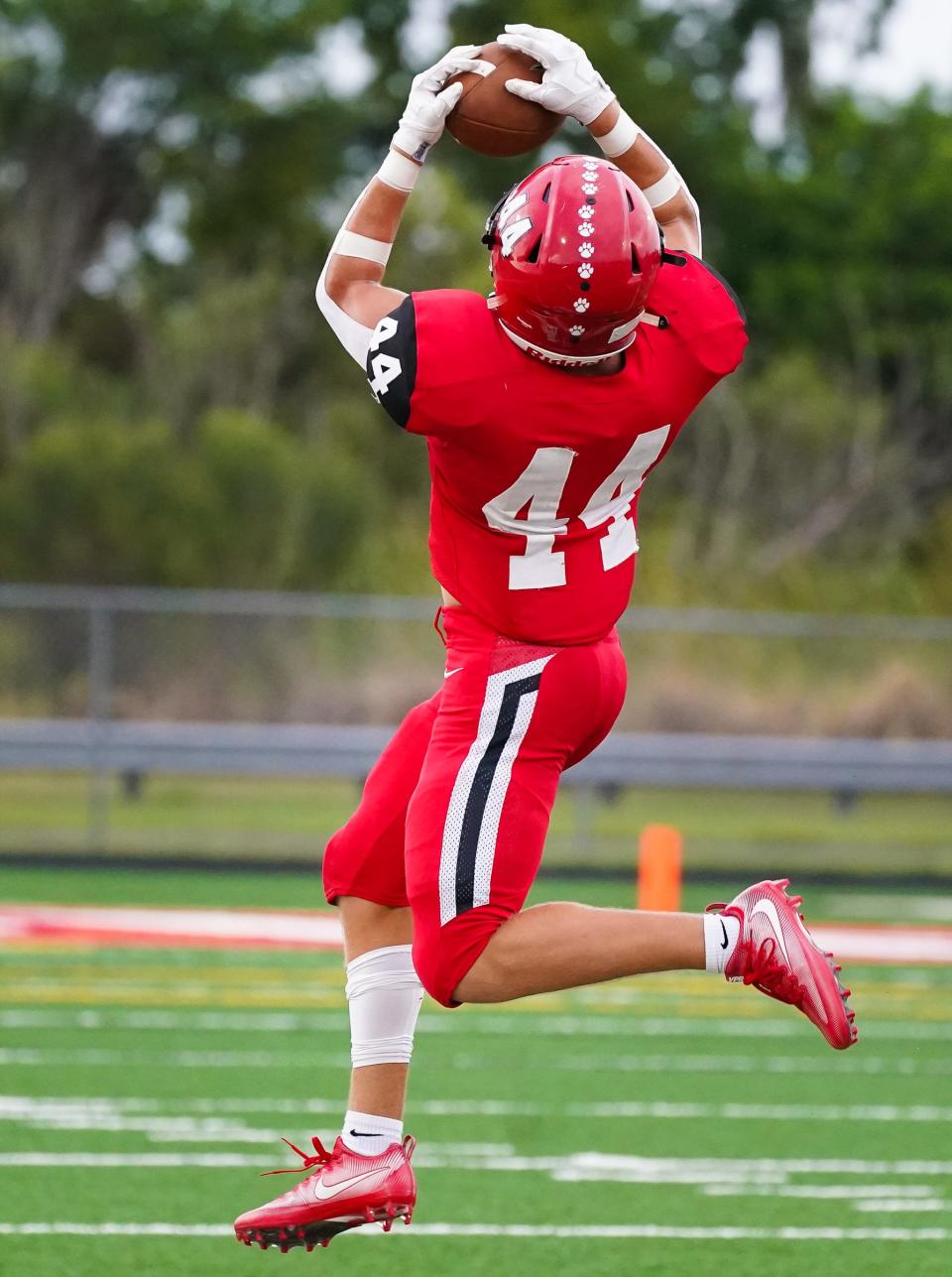 Cardinal Mooney's J.R. Rosenberg pulls down a pass during Thursday's preseason football game against Booker.