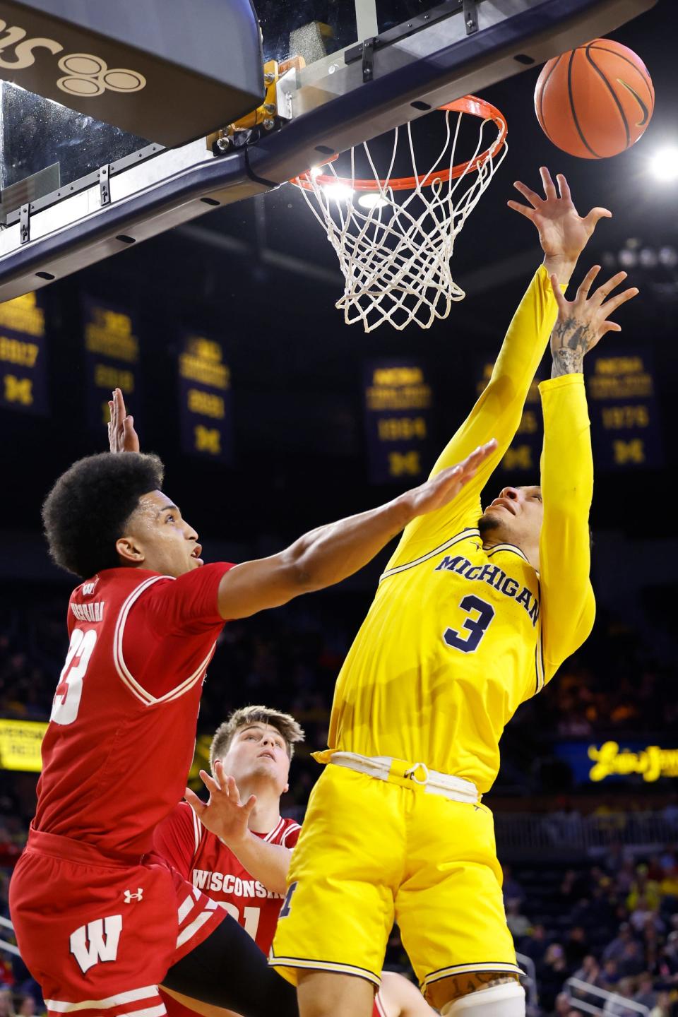 Feb 7, 2024; Ann Arbor, Michigan, USA; Michigan Wolverines guard Jaelin Llewellyn (3) shoots on Wisconsin Badgers guard Chucky Hepburn (23) in the first half at Crisler Center. Mandatory Credit: Rick Osentoski-USA TODAY Sports