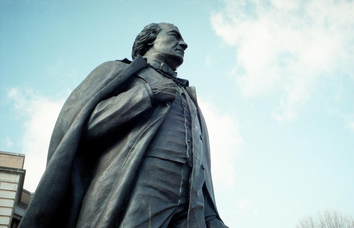 A statue of the nation’s first impeached president Andrew Johnson, here in Greeneville, Tenn., on Jan. 19, 1999, stands across the street from where he once worked as a tailor. Johnson survived impeachment by being acquitted by one vote.