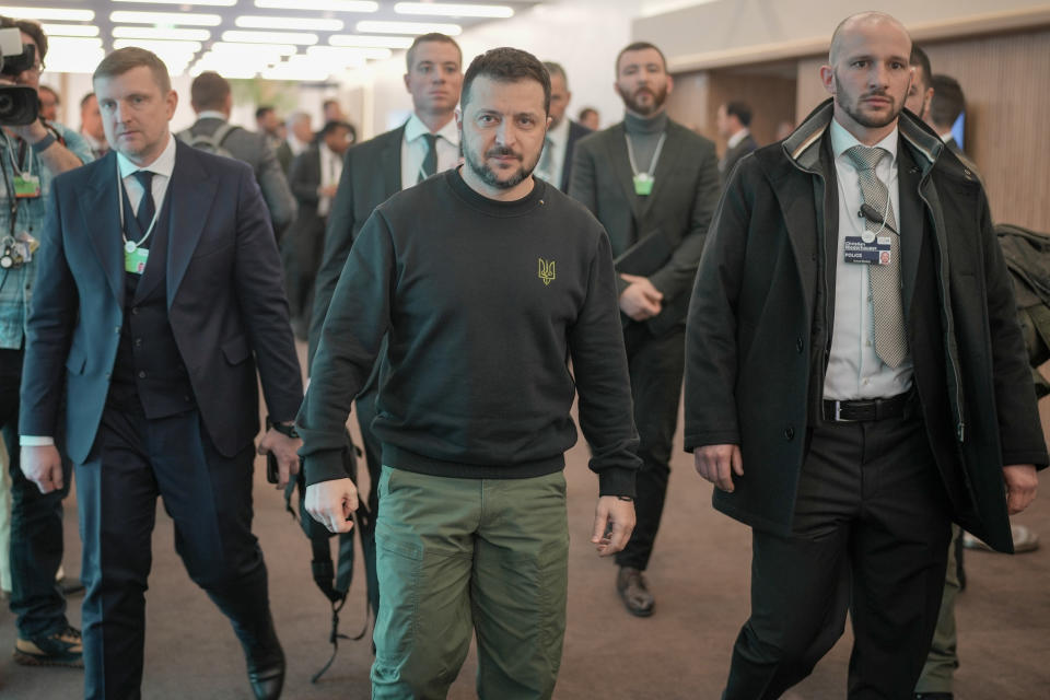 Ukrainian President Volodymyr Zelenskyy, centre, leaves after meeting U.S. Secretary of State Antony Blinken at the Annual Meeting of World Economic Forum in Davos, Switzerland, Tuesday, Jan. 16, 2024. The annual meeting of the World Economic Forum is taking place in Davos from Jan. 15 until Jan. 19, 2024.(AP Photo/Markus Schreiber)