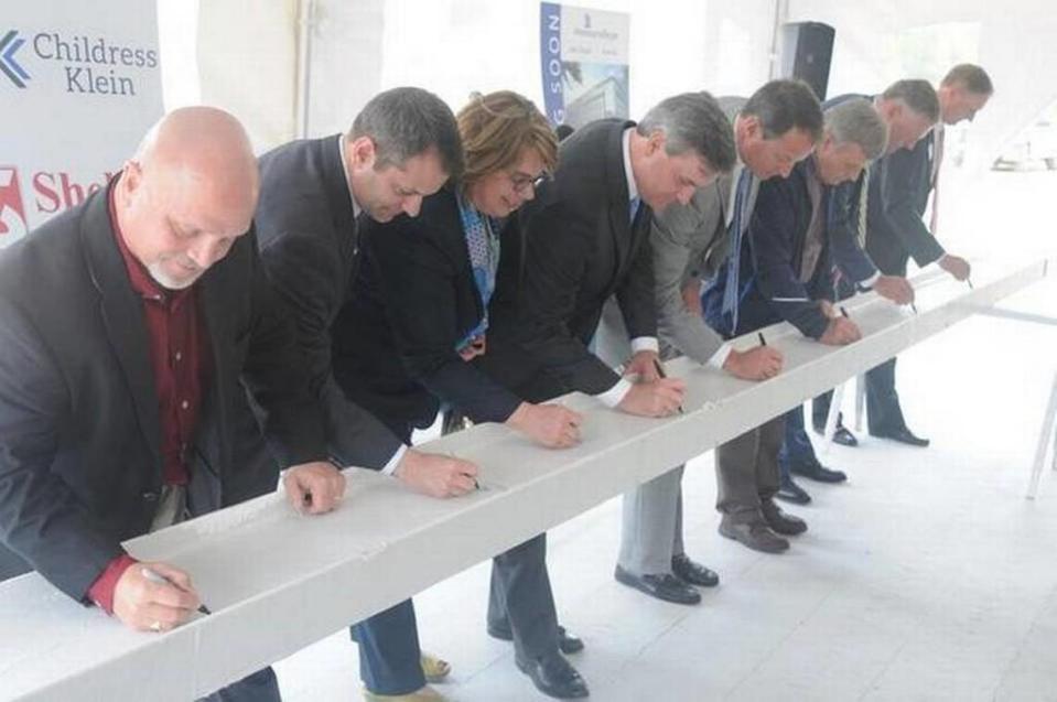 Annual job growth for York County more than quadrupled the national average this spring, according to the Bureau of Labor Statistics. Former Fort Mill Mayor Danny Funderburk, left, signed the final beam in 2015 to go atop the new Lash Group headquarters in Kingsley North.