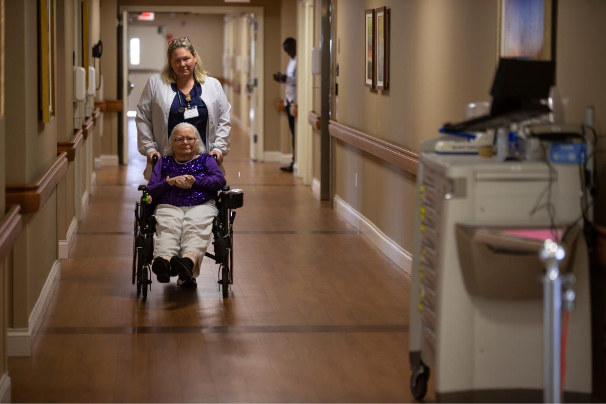 Resident Helen Walsh with staff nurse Joanna Jacobs L.P.N. New Jersey nursing homes are struggling to hire enough workers to meet the state's minimum staffing ratios.