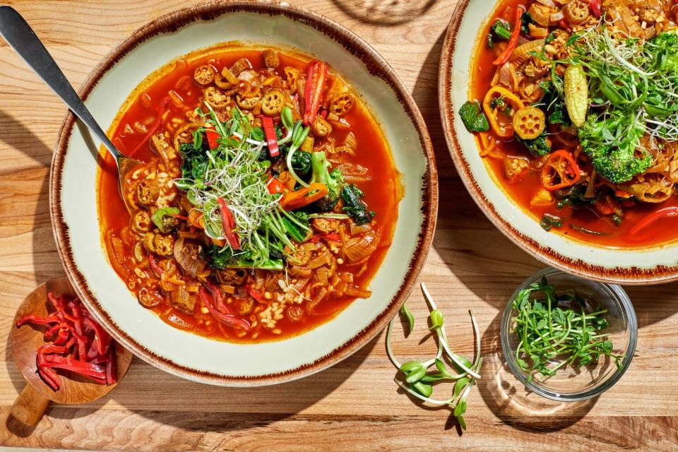 Chef Keith Corbin's vegetarian gombo, in two bowls sitting on a wooden surface.