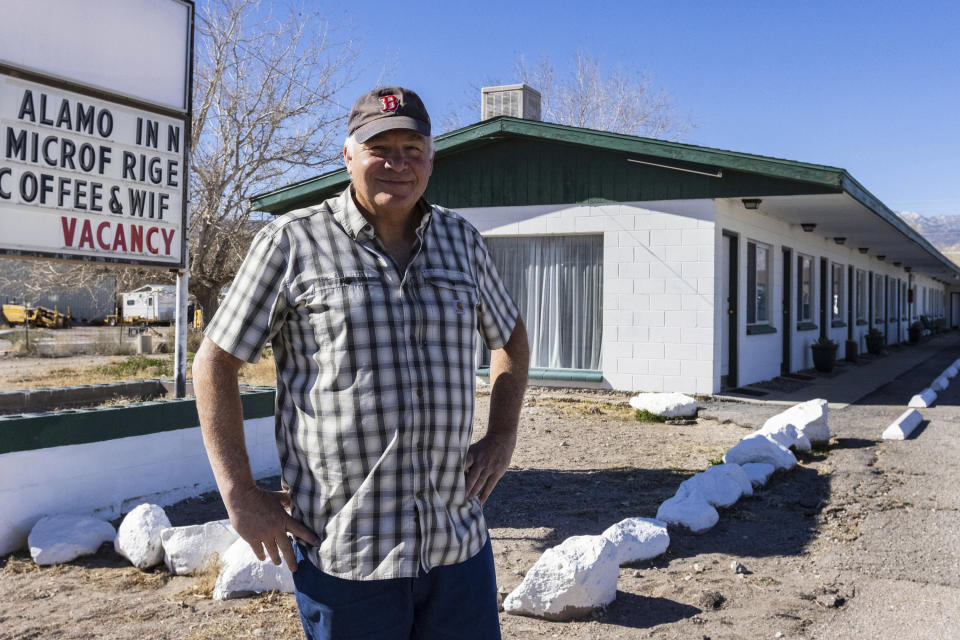 Vern Holaday, owner of Alamo Inn and chair of the Alamo town board, poses for a photo on U.S. Route 93, on Friday, Feb. 10, 2023, in Alamo, Nev. The town of Alamo board has requested the Lincoln County Commission to change its ordinance to permit the sale of alcoholic beverages in the town's limits. (Bizuayehu Tesfaye/Las Vegas Review-Journal via AP)