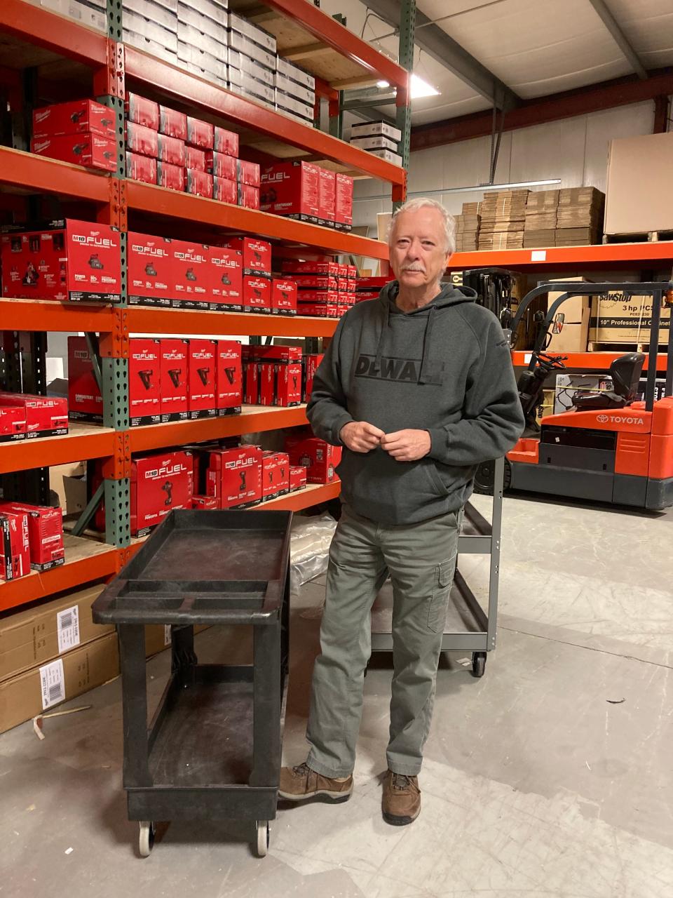 Jeff Burns, co-owner of Burns Power Tools which was destroyed in a fire in November, stands in the store's new Tiverton location.