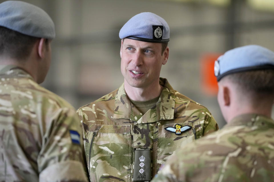 Britain's Prince William speaks to service personal at the Army Aviation Centre in Middle Wallop, England, Monday, May 13, 2024. King Charles III officially handed over the role of Colonel-in-Chief of the Army Air Corps to Prince William, The Prince of Wales. (AP Photo/Kin Cheung, Pool)