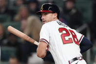 Atlanta Braves first baseman Matt Olson (28) follows through on a double in the sixth inning of a baseball game against the Cincinnati Reds Friday, April 8, 2022, in Atlanta. (AP Photo/John Bazemore)