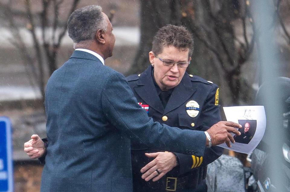 Jackson County Executive Frank White, left, embraces a police officer after attending a visitation for fallen Independence police officer Cody Allen, 35, at Community of Christ on Thursday, March 7, 2024, in Independence. Allen, a husband and father of two children, was shot and killed last Thursday during an eviction in Independence.