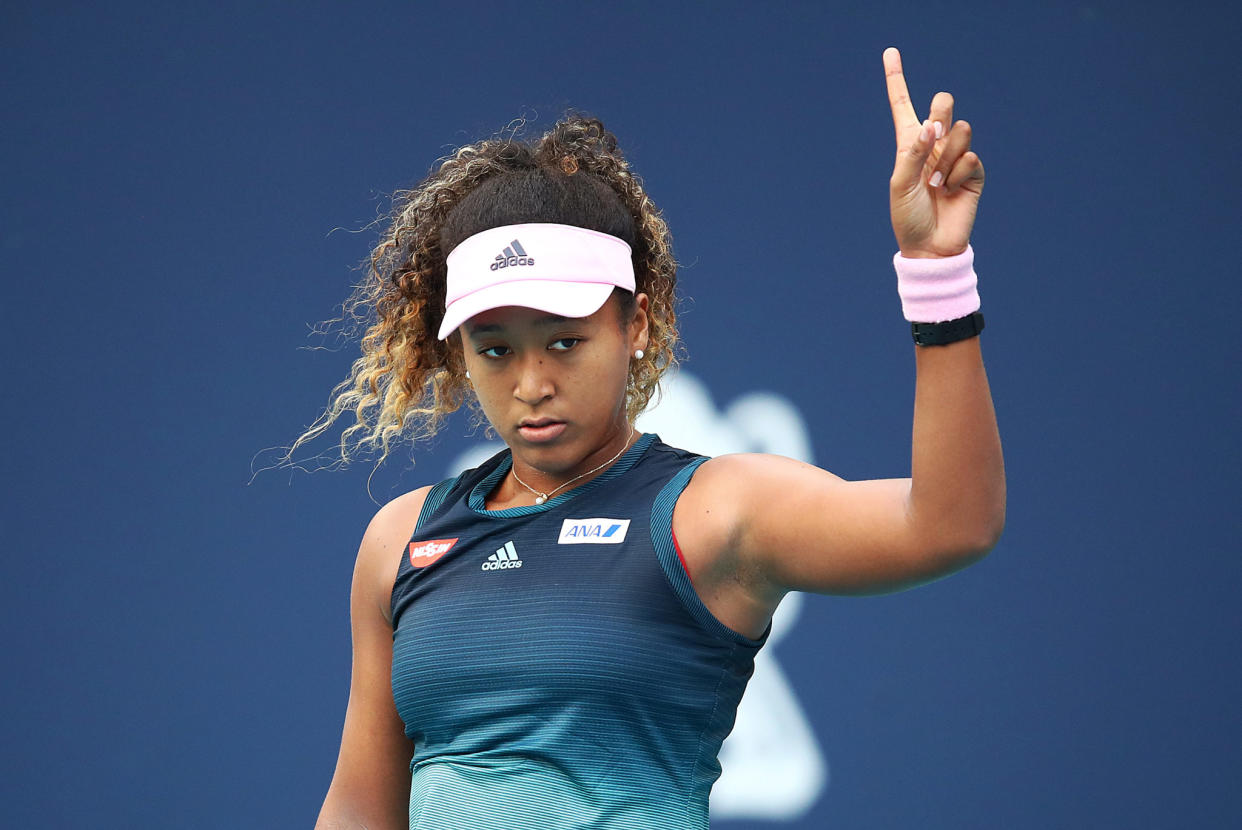 Naomi Osaka playing tennis.