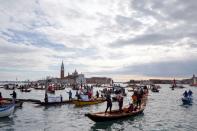 Scores of boats take to the Saint Mark's Basin, as Venetians protest against the damage caused by big ships, in Venice