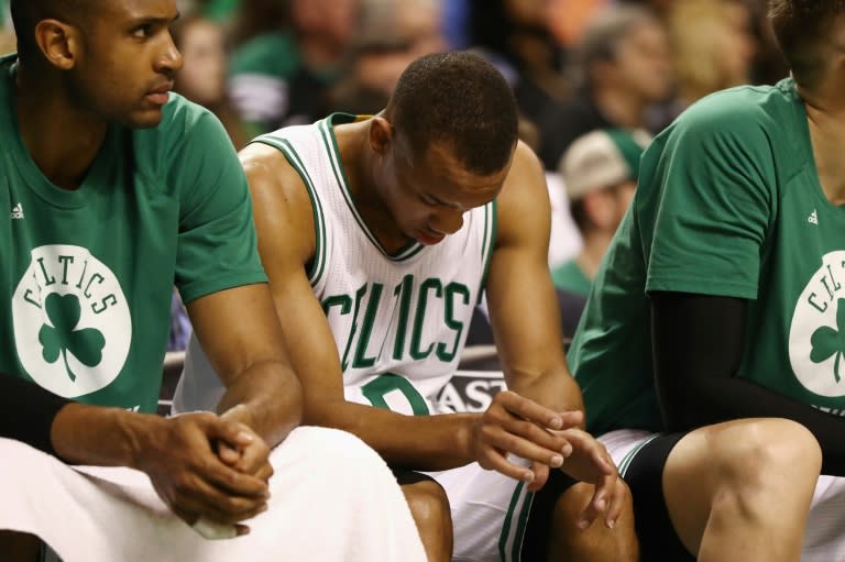 Avery Bradley (C) of the Boston Celtics reacts on the bench in the second half against the Cleveland Cavaliers in Game Five of the 2017 NBA Eastern Conference Finals, at TD Garden in Boston, Massachusetts, on May 25