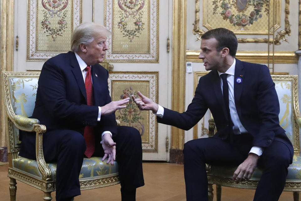 President Donald Trump and French President Emmanuel Macron gesture during their meeting inside the Elysee Palace in Paris Saturday Nov. 10, 2018. Trump is joining other world leaders at centennial commemorations in Paris this weekend to mark the end of World War I. (AP Photo/Jacquelyn Martin)