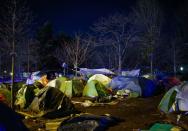 French police clear out migrants from an illegal camp in north Paris