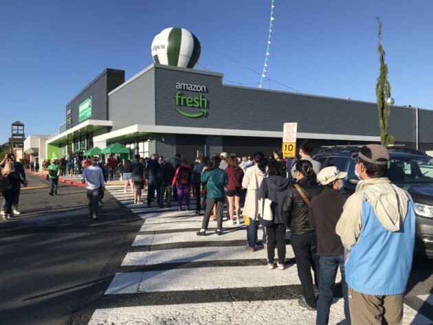 Customers line up to get into a new Amazon Fresh store in Bellevue, Wash. (GeekWire Photo / Alan Boyle)