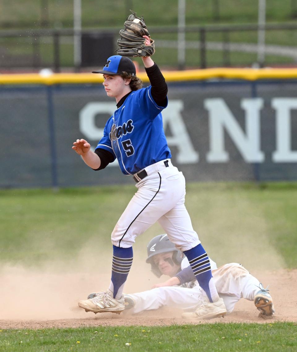 Mashpee shortstop Colton Colleran holds onto the ball after tagging Seamus Vining of Sandwich at second.
(Credit: Ron Schloerb/Cape Cod Times)