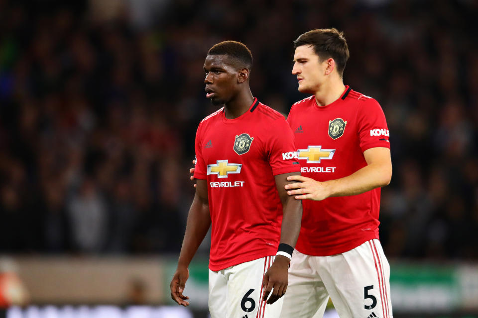 WOLVERHAMPTON, ENGLAND - AUGUST 19: Paul Pogba of Manchester United talks with teammate Harry Maguire during the Premier League match between Wolverhampton Wanderers and Manchester United at Molineux on August 19, 2019 in Wolverhampton, United Kingdom. (Photo by Chris Brunskill/Fantasista/Getty Images)