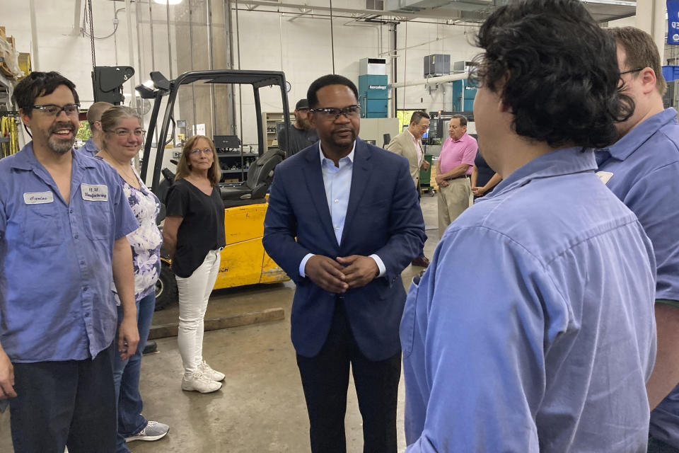 Republican candidate for Illinois governor Richard Irvin speaks with employees during a tour of HM Manufacturing Inc. in Wauconda, Ill., June 21, 2022. Irvin is seeking the Republican nomination to face Democratic Gov. J.B. Pritzker in November. (AP Photo/Sara Burnett)