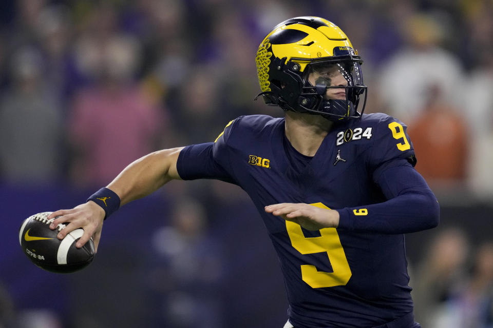 Michigan quarterback J.J. McCarthy passes against Washington during the first half of the national championship NCAA College Football Playoff game Monday, Jan. 8, 2024, in Houston. (AP Photo/Godofredo A. Vasquez)