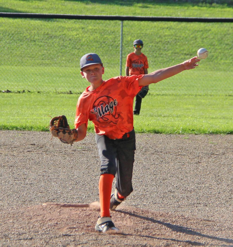 Quincy's JJ Wright delivers a pitch in the final inning of The Village's win over Coldwater Friday