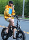 <p>Justin Bieber bikes barefoot around his L.A. neighborhood on Thursday. </p>