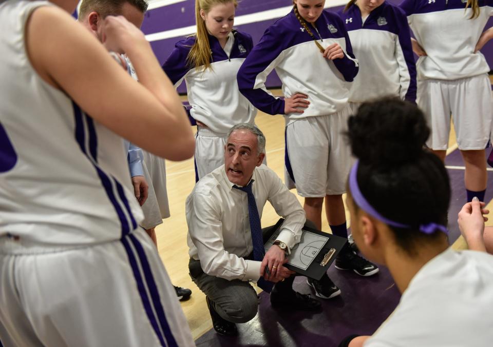 RFH coach George Sourlis talks to his team at the end of the first quarter. Rumson-Fair Haven hosted Manasquan in girls basketball on Friday, January 23, 2015.